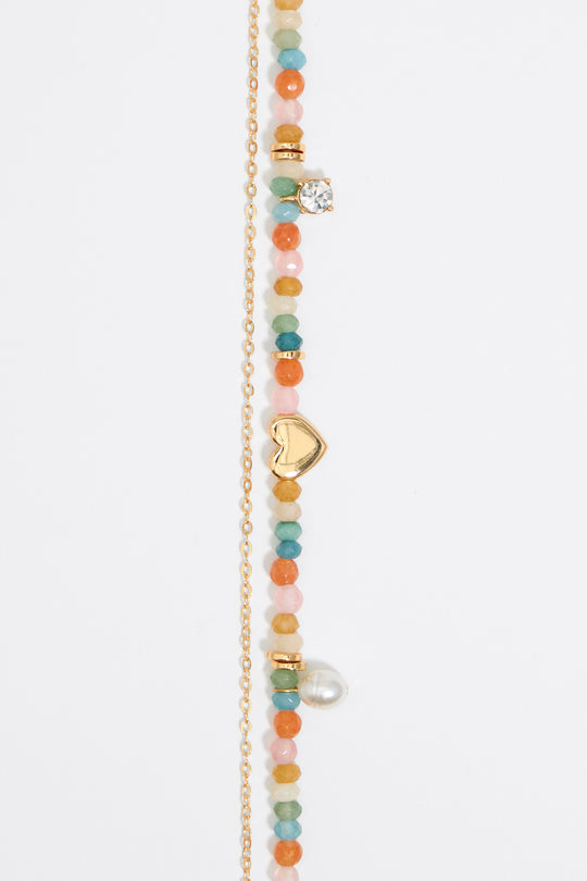 Pink stones and gold heart necklace