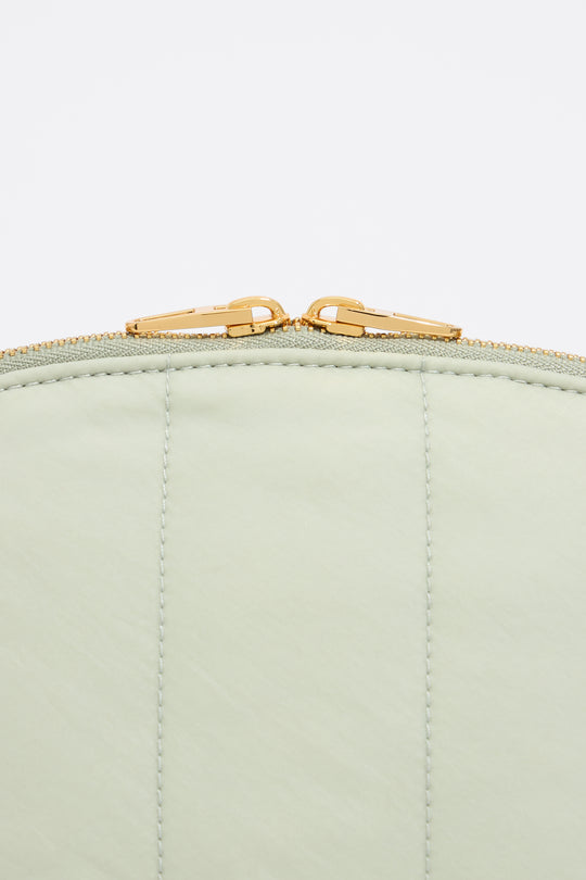 Large aquamarine nylon half-moon make-up case