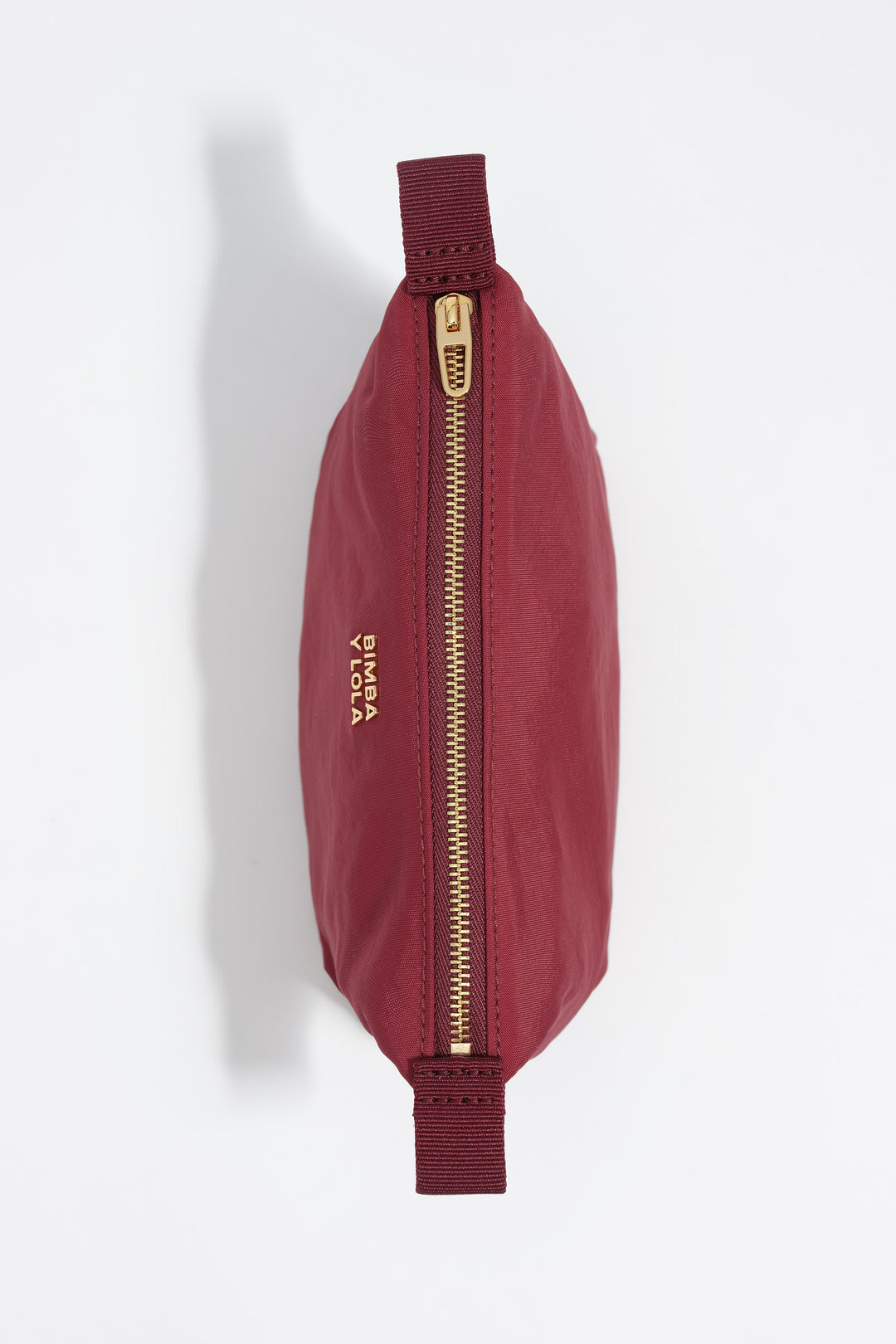 Small burgundy nylon Trapecio make-up case