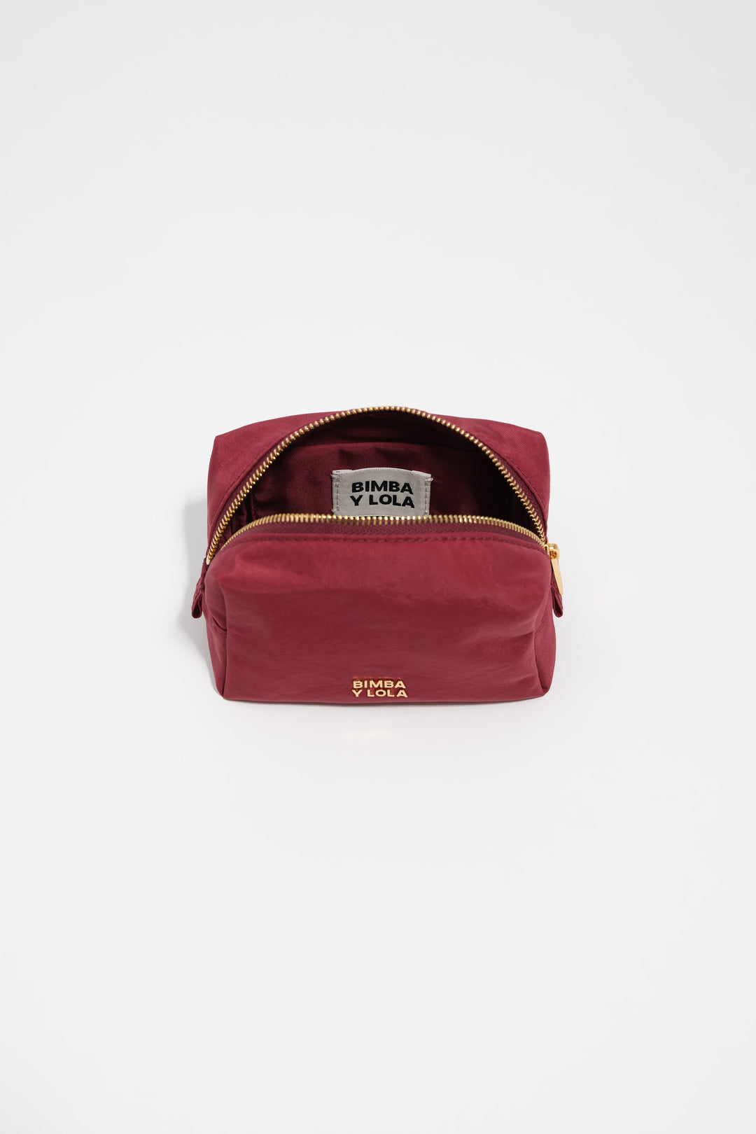 Small burgundy nylon make-up case