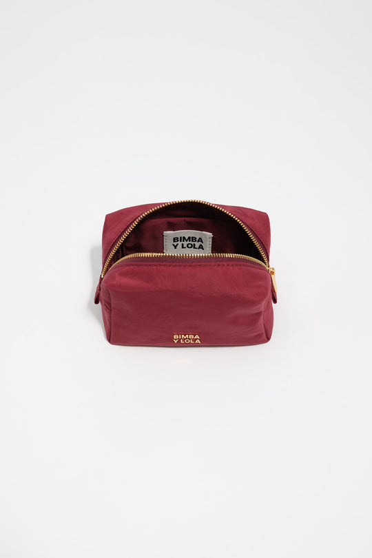 Small burgundy nylon make-up case