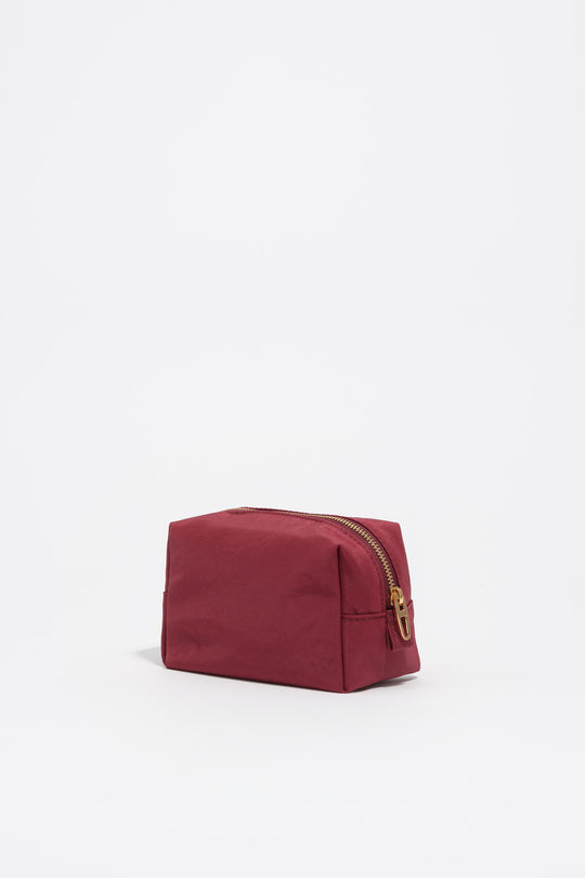 Small burgundy nylon make-up case