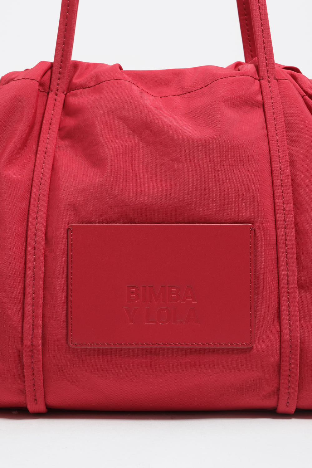 Large red nylon shoulder bag