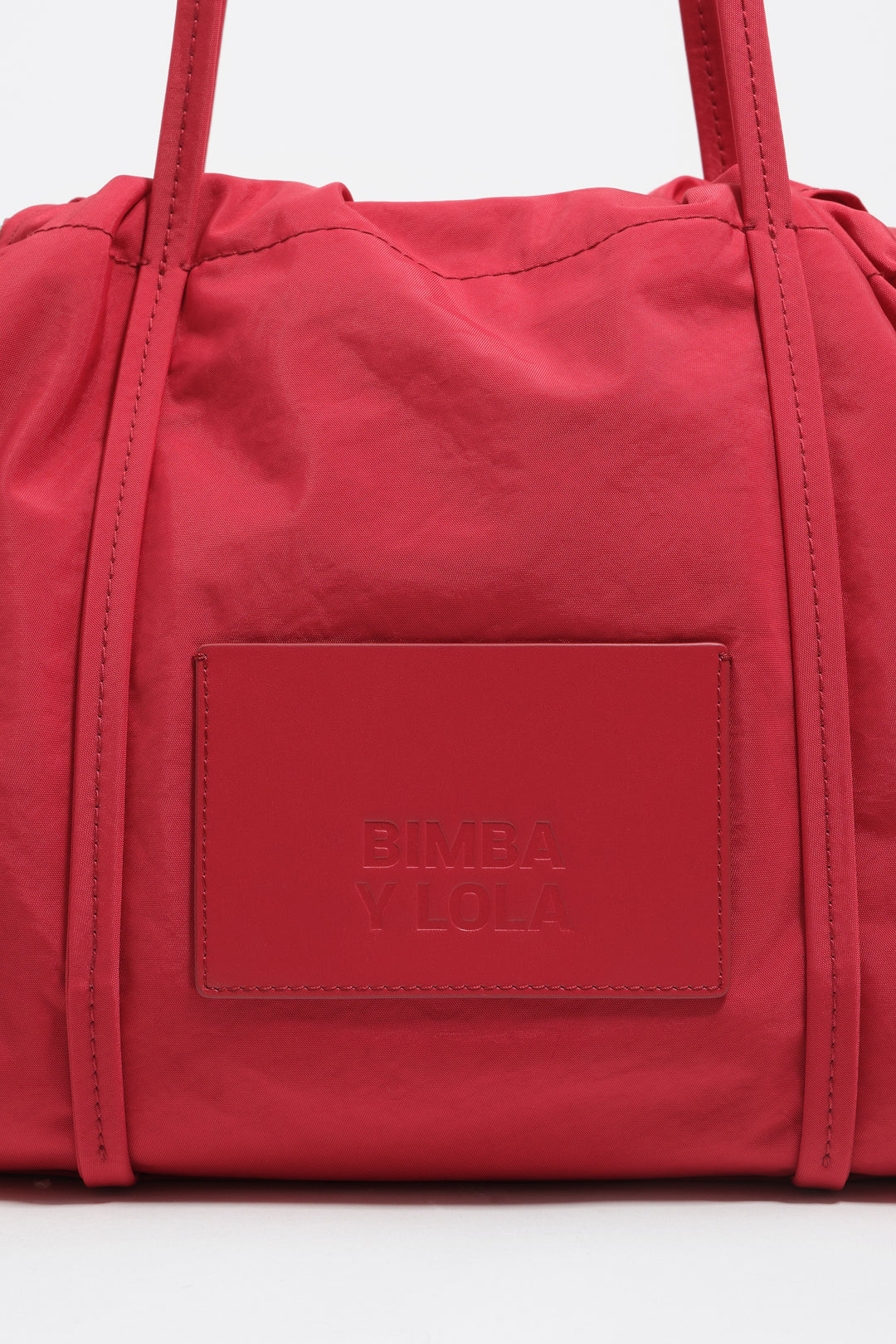 Large red nylon shoulder bag