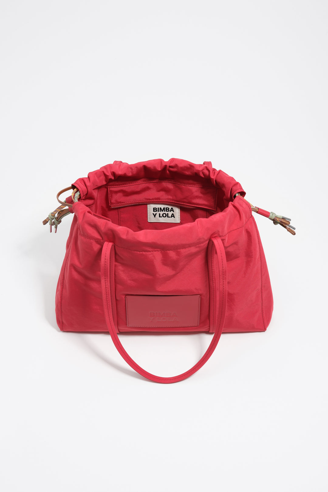 Large red nylon shoulder bag