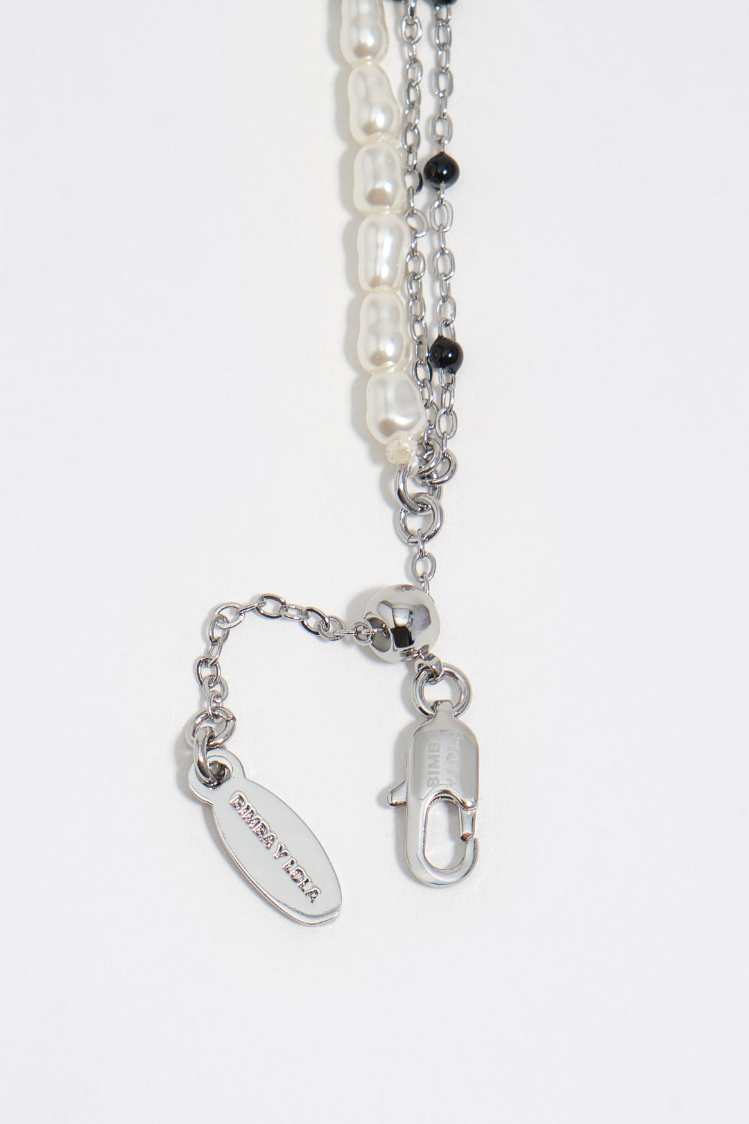 Triple silver-tone chain and pearl heart logo bracelet