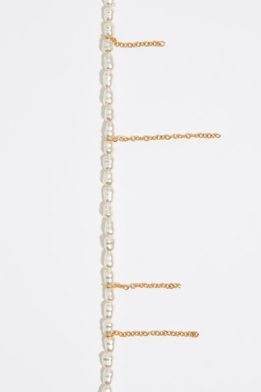 Golden chain and pearls bracelet