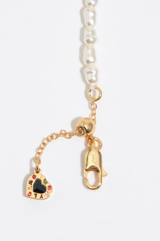 Golden chain and pearls bracelet