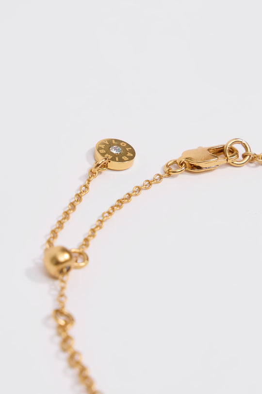 Aged gold necklace with fish and seashells