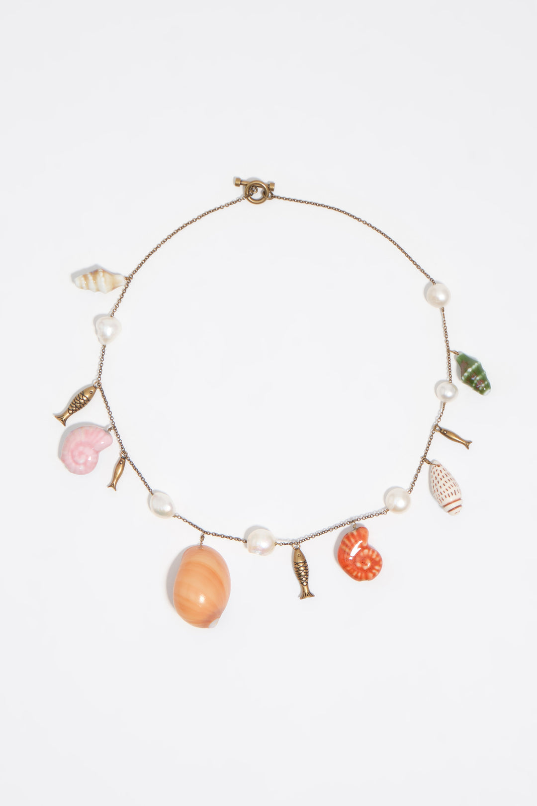 Aged gold necklace with fish and shells