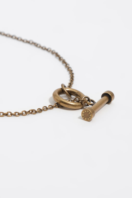 Aged gold necklace with fish and shells