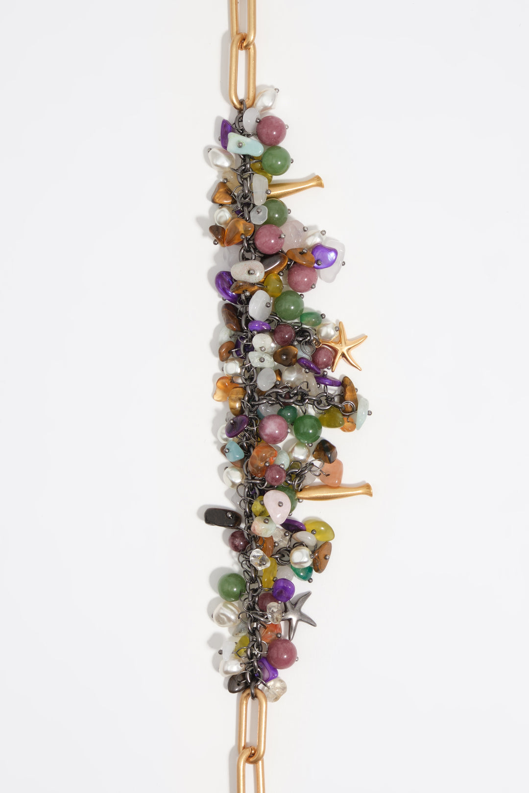 Aged gold necklace with stones and fish