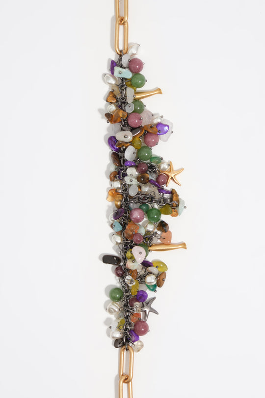 Aged gold necklace with stones and fish