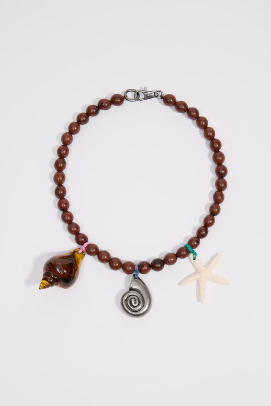 Aged silver necklace with stones and seashells