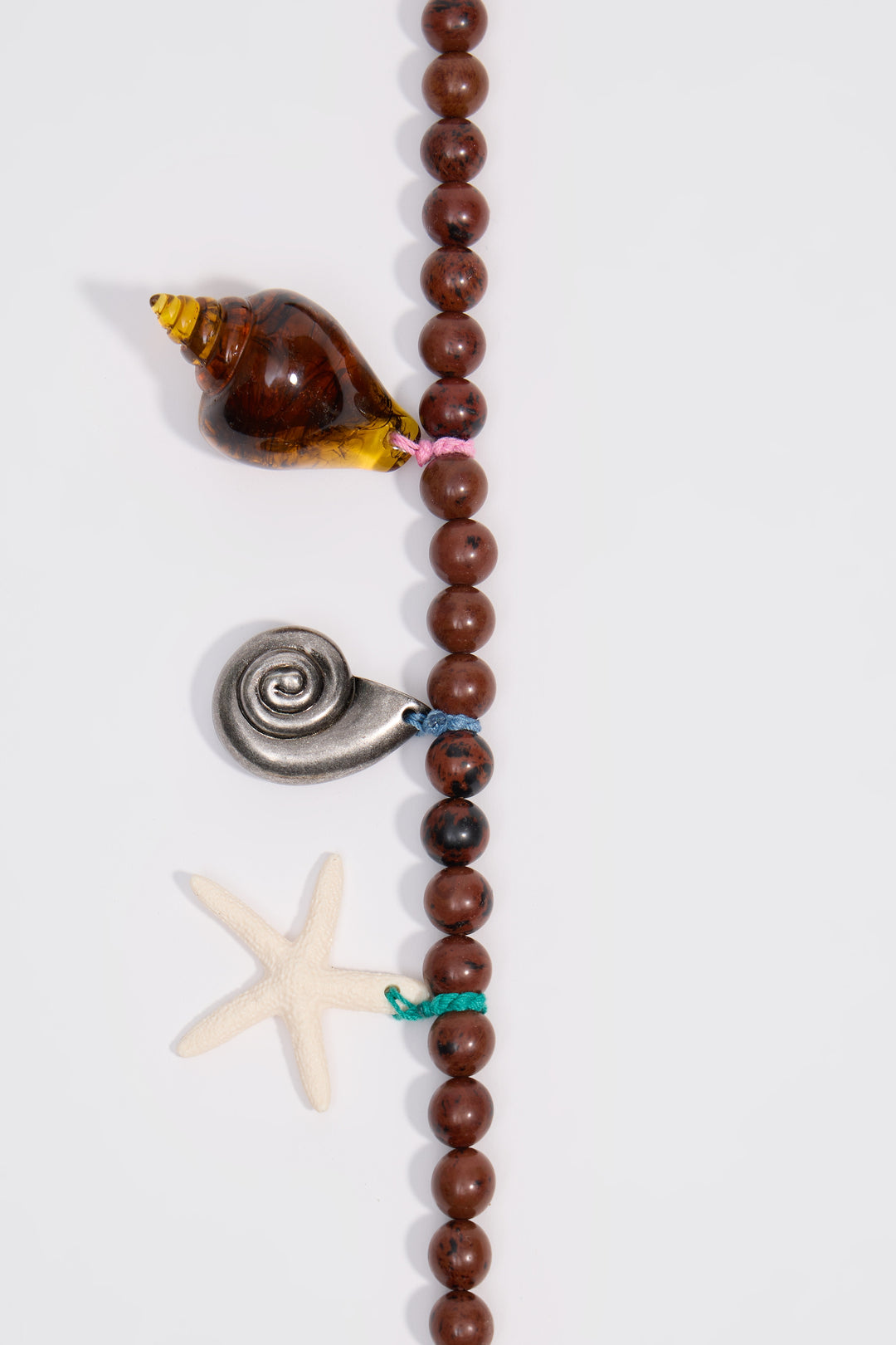 Aged silver necklace with stones and seashells