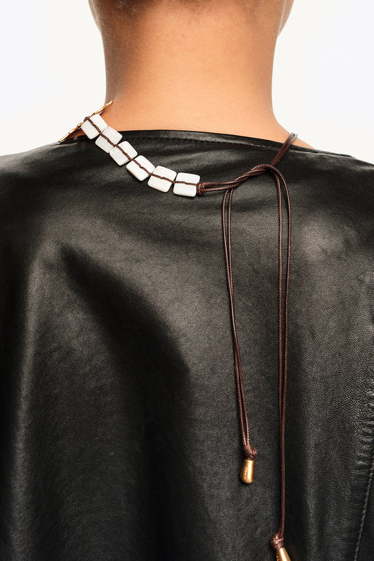 Brushed gold sun and animal necklace