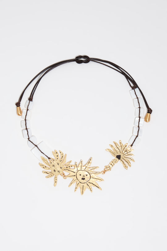 Brushed gold sun and animal necklace