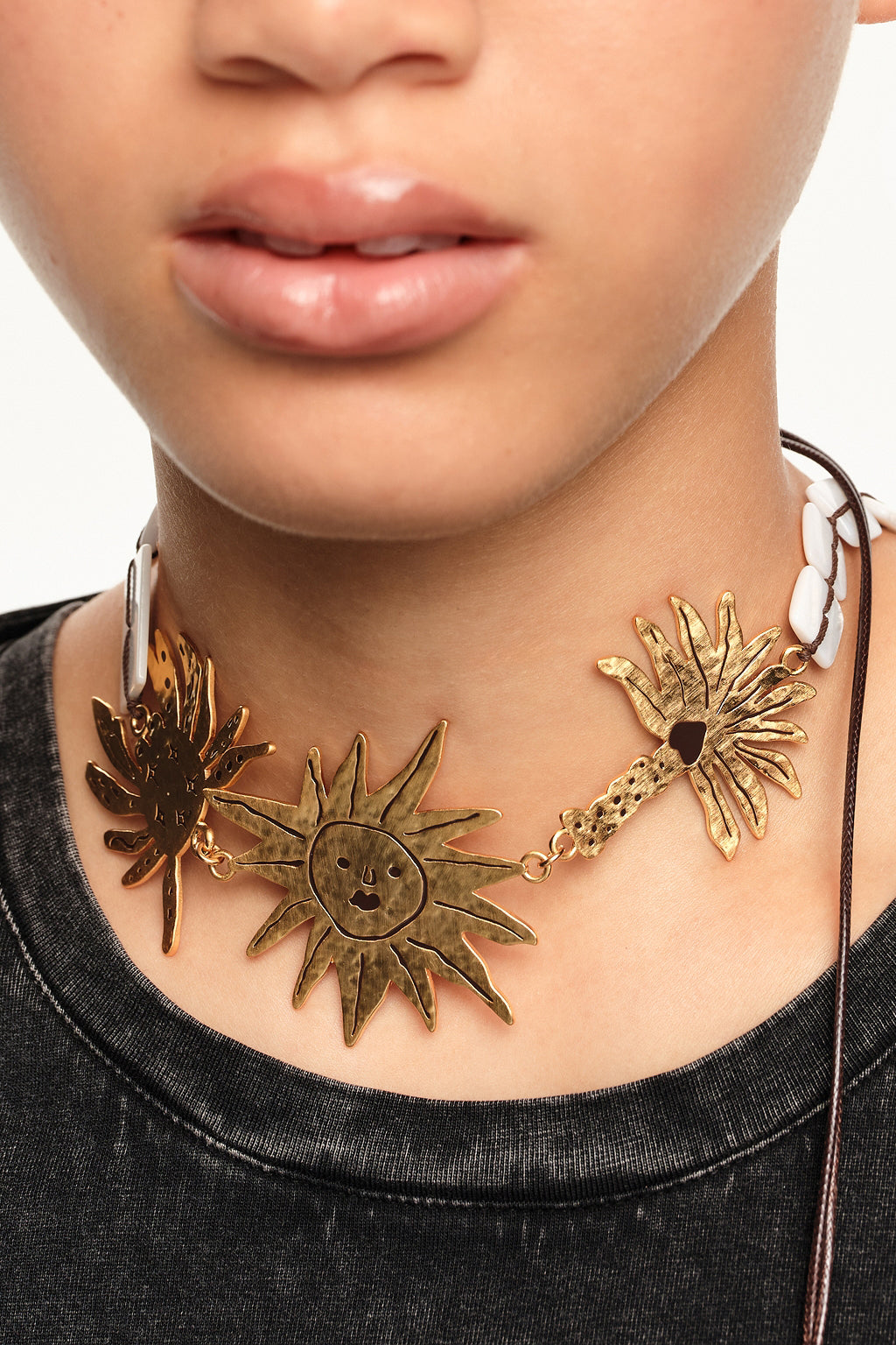 Brushed gold sun and animal necklace