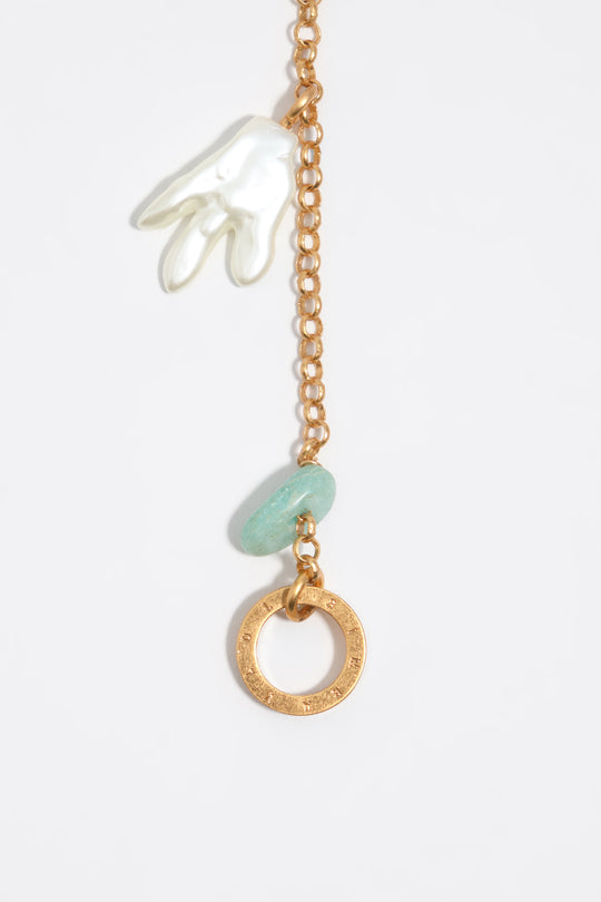 Aged gold necklace with stones and shells