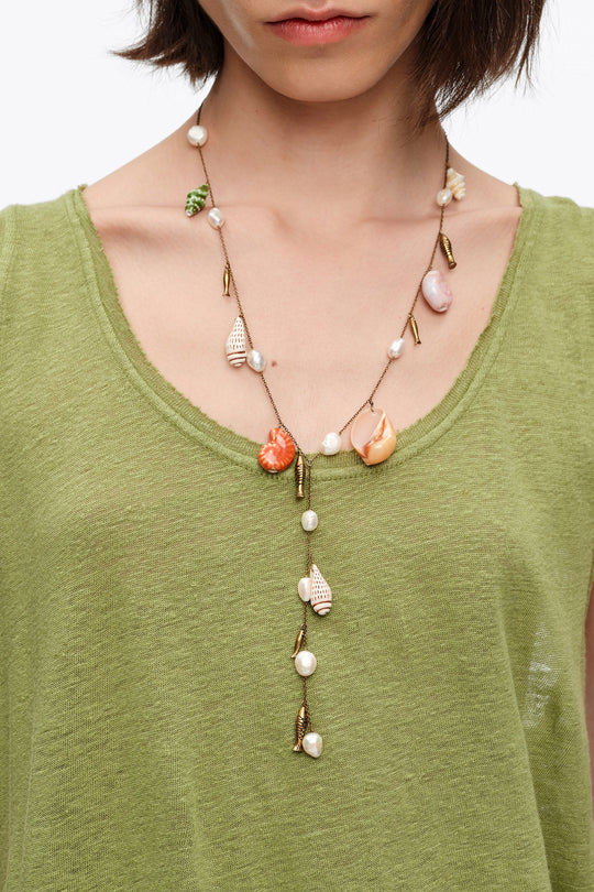 Aged gold necklace with ceramic fish and shells