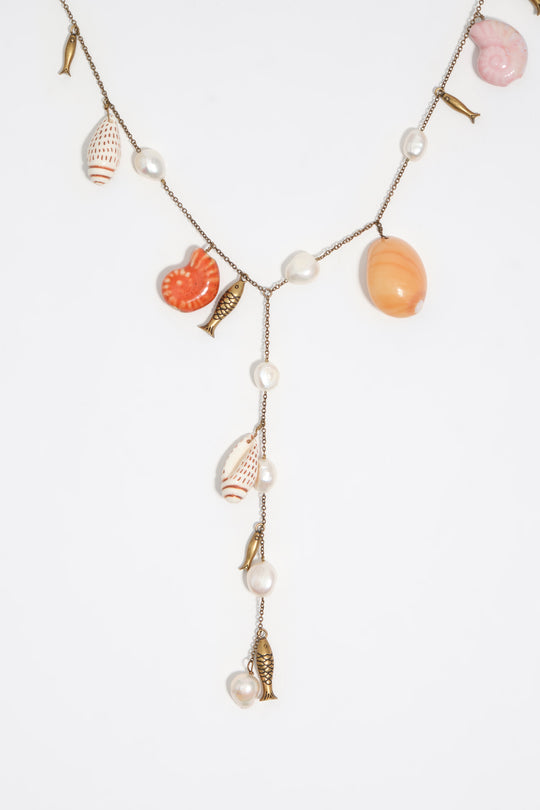 Aged gold necklace with ceramic fish and shells