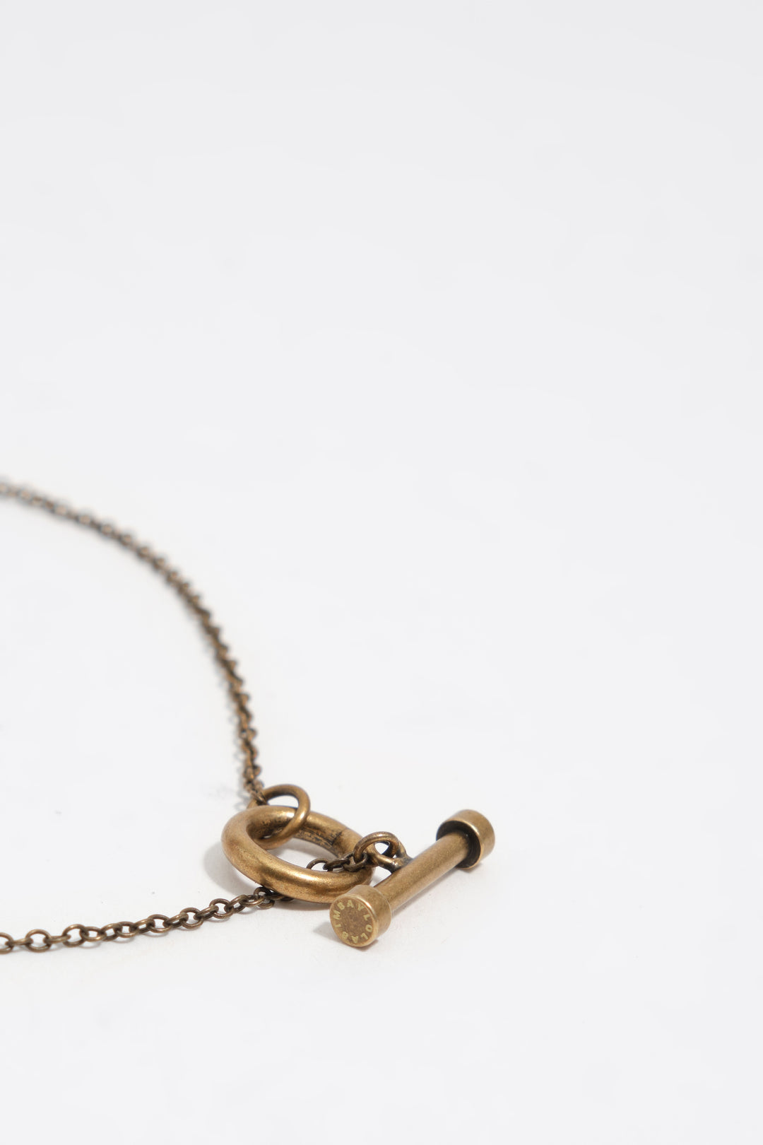 Aged gold necklace with ceramic fish and shells