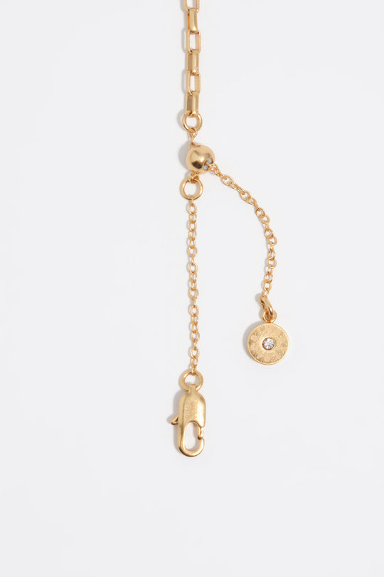 Aged gold necklace with shells and fish
