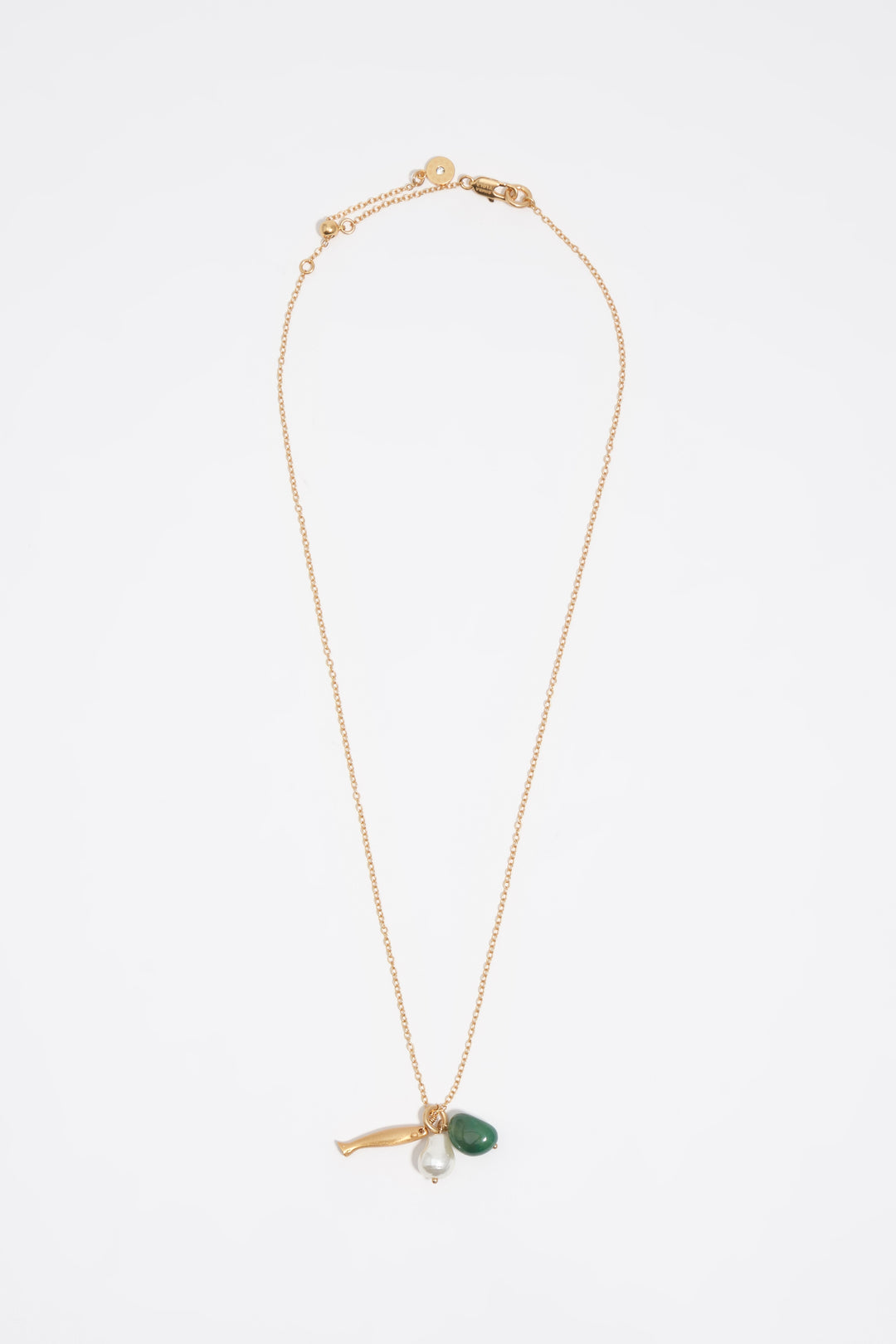 Aged gold necklace with fish and stone