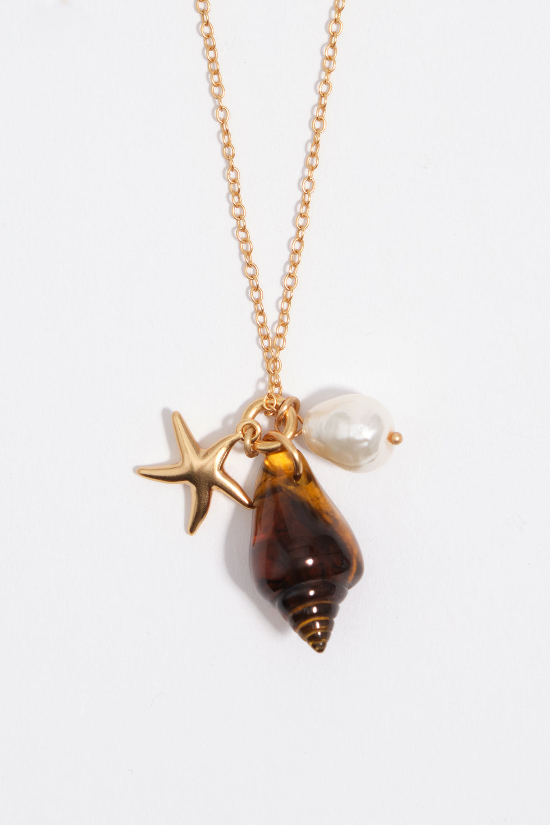 Aged gold star and shell necklace