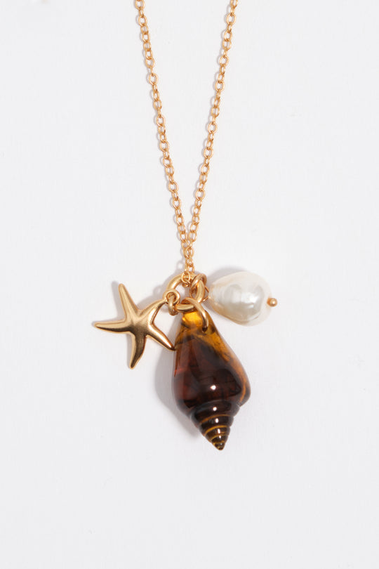 Aged gold star and shell necklace