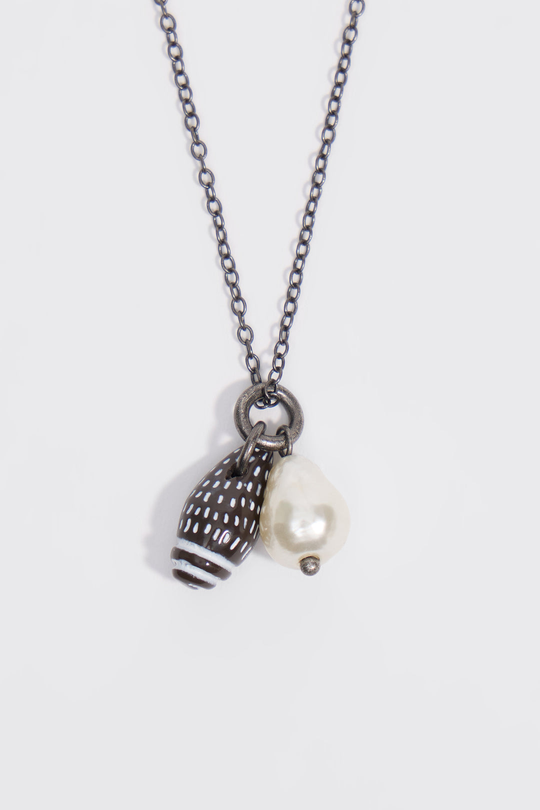 Aged silver necklace with seashell and pearl
