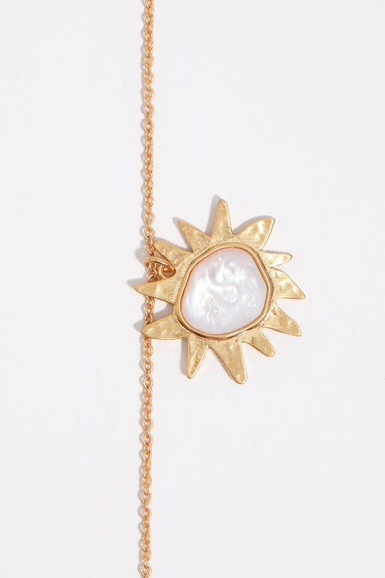 Brushed gold mother-of-pearl sun necklace