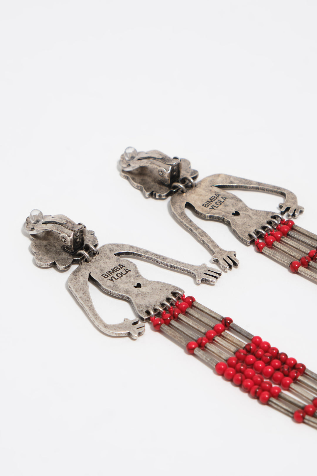 Aged silver metal silhouette and stones earrings