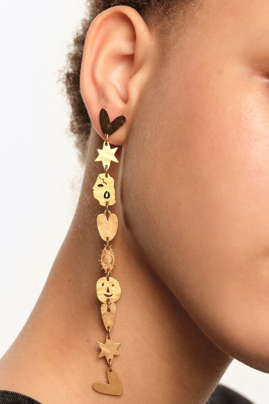 Matte gold metal silhouette earrings