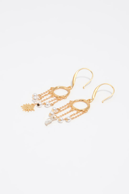 Sun and moon earrings with brushed gold chains and pearls