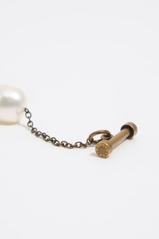 Aged gold bracelet with pearls, shells and fish