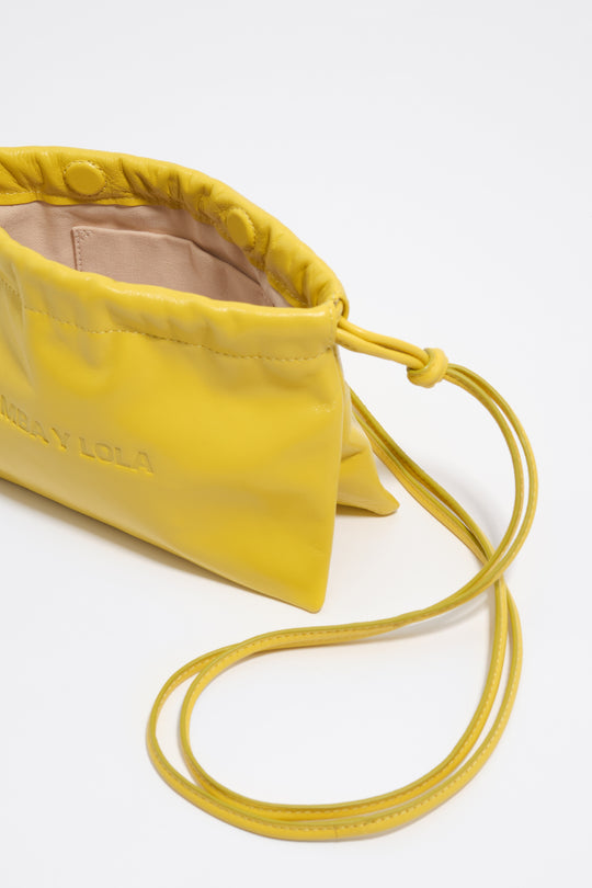 Mini yellow leather clutch bag