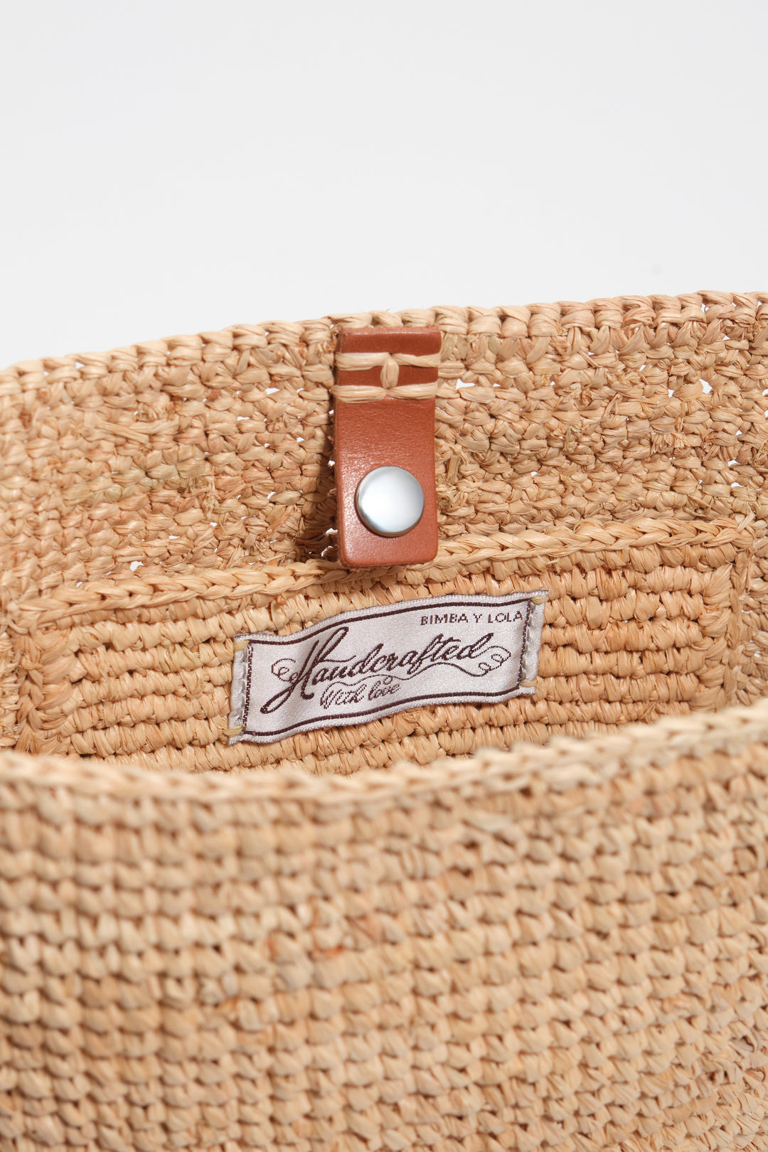 Small natural raffia plaited bag
