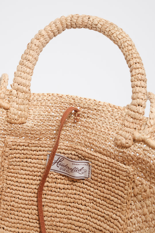 Large natural raffia plaited bag