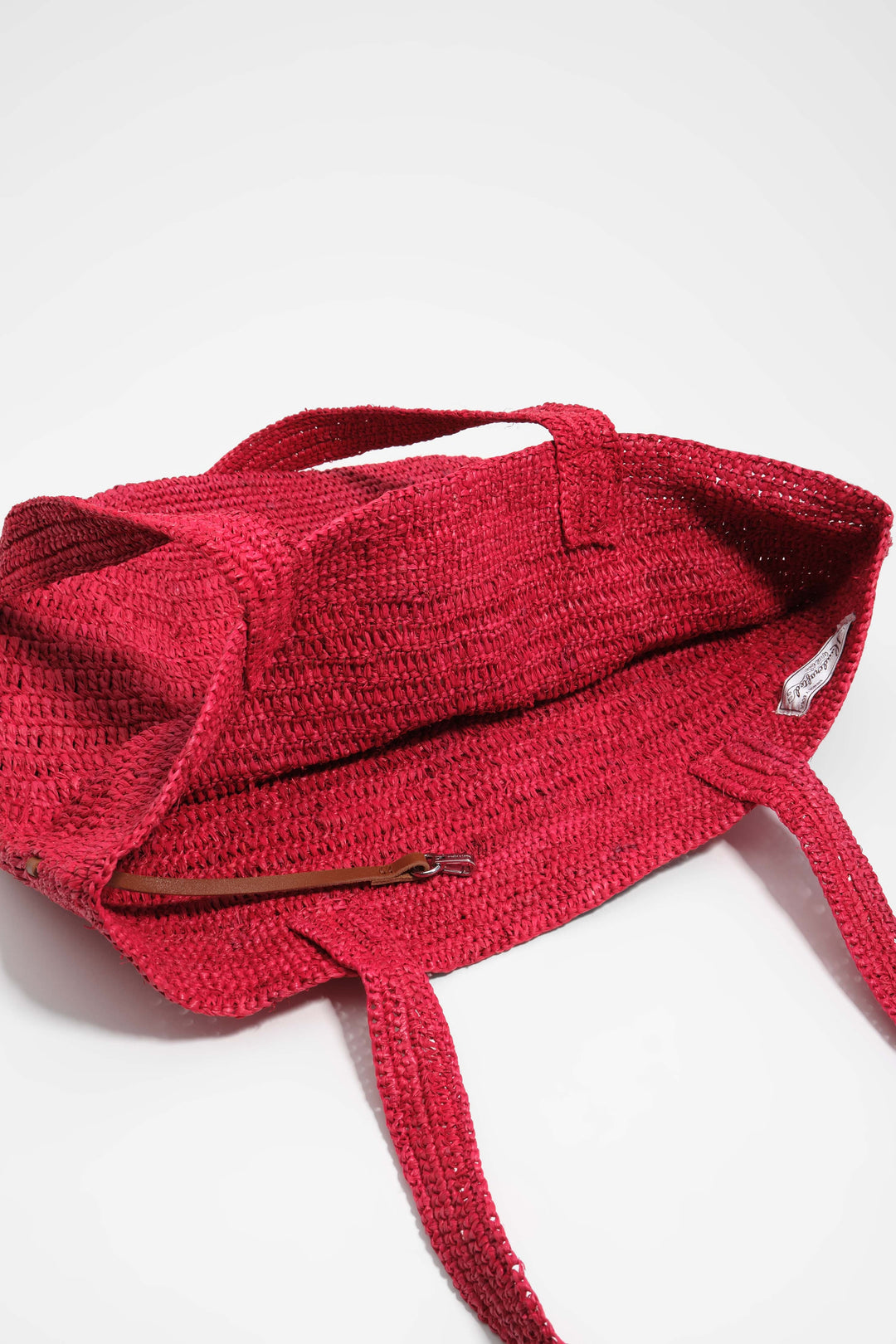 Large red plaited bag