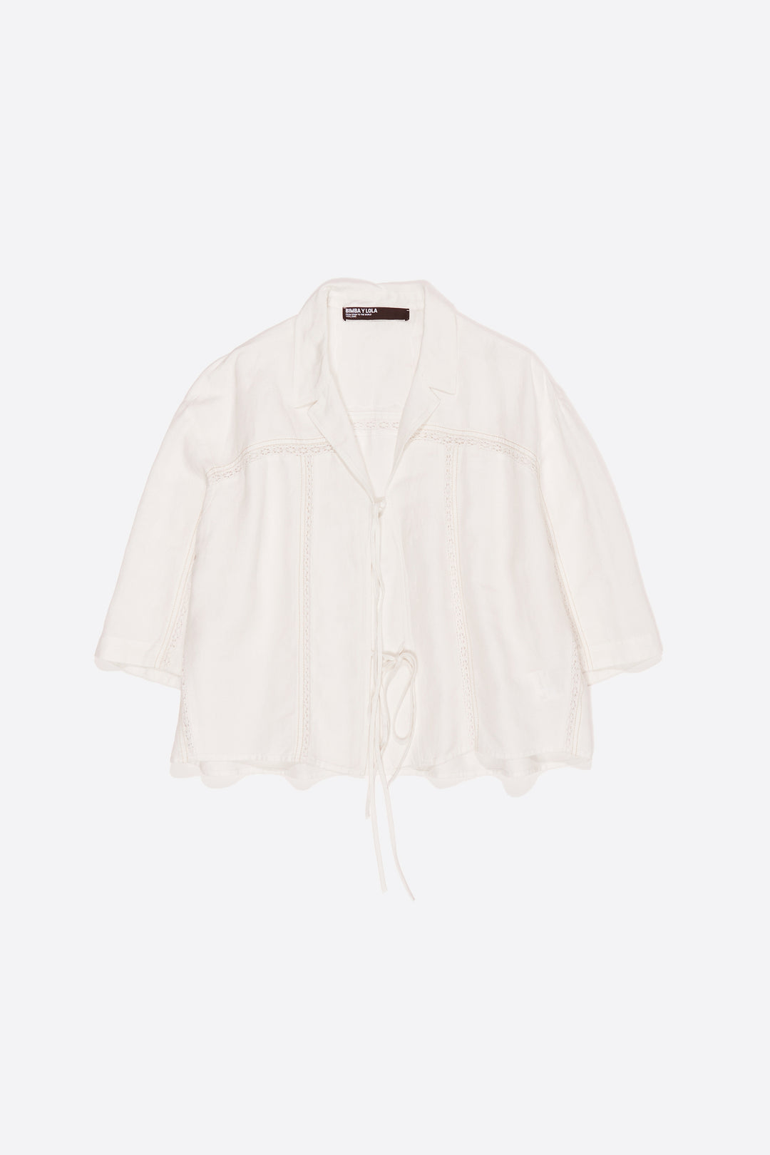 White linen shirt with ties and lace
