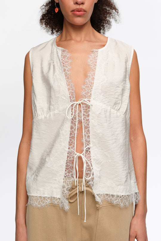 White short-sleeve shirt with lace and ties