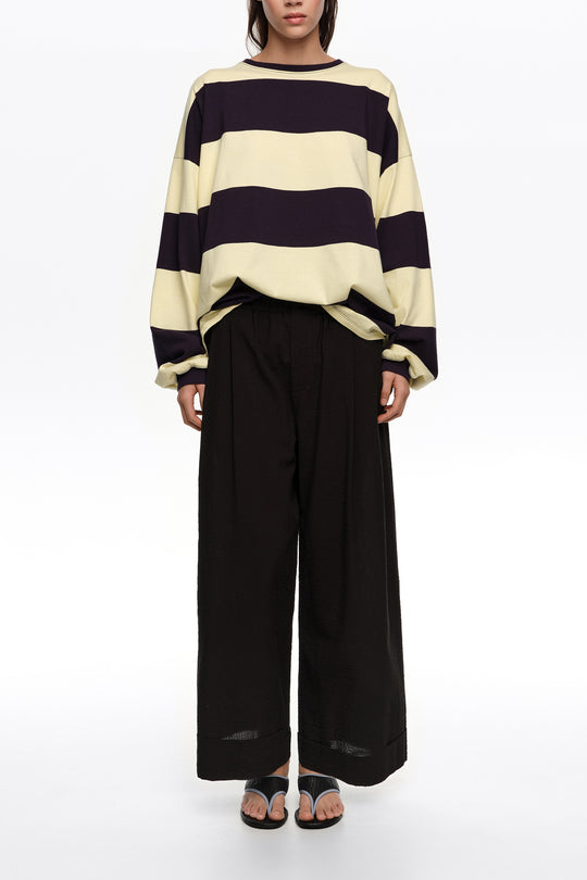 Black textured bell-bottom trousers