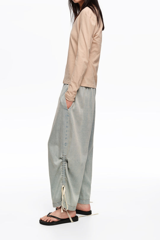 Light blue denim joggers with gathering