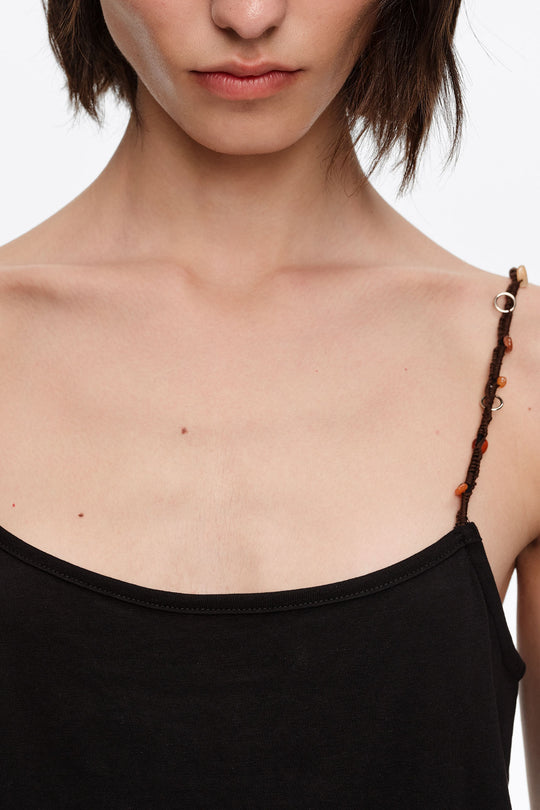 Black strappy top with decorative stones