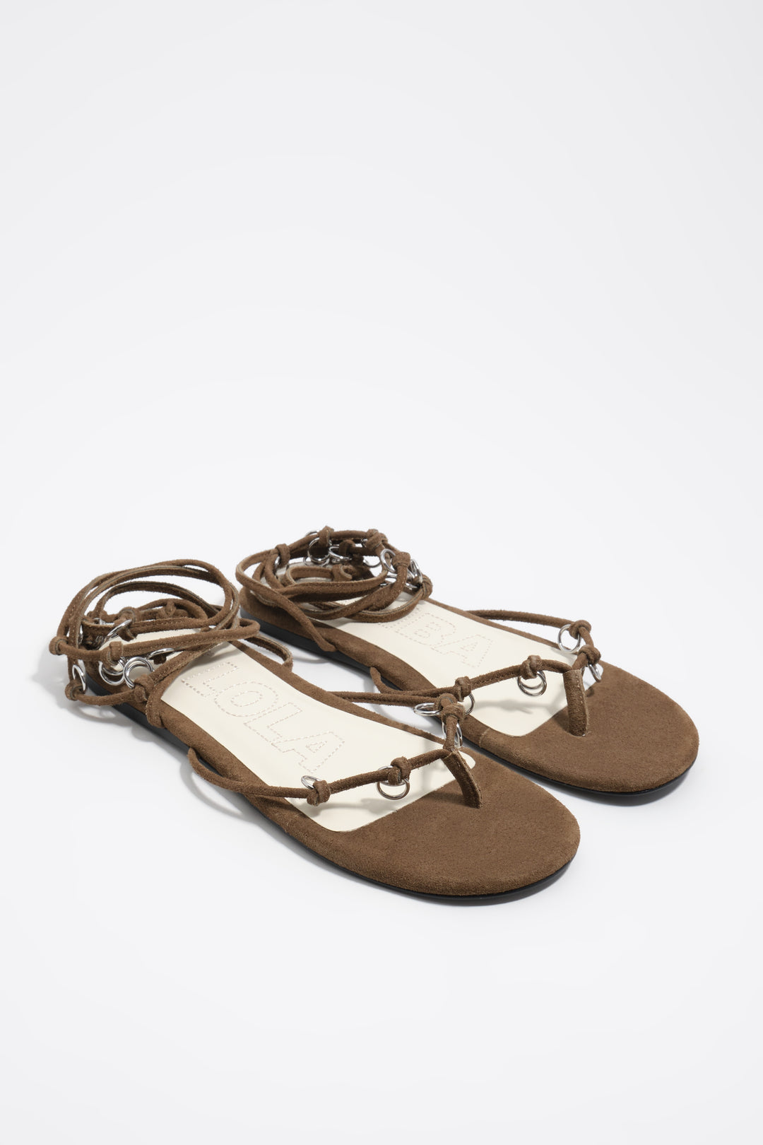 Olive suede sandal with piercings