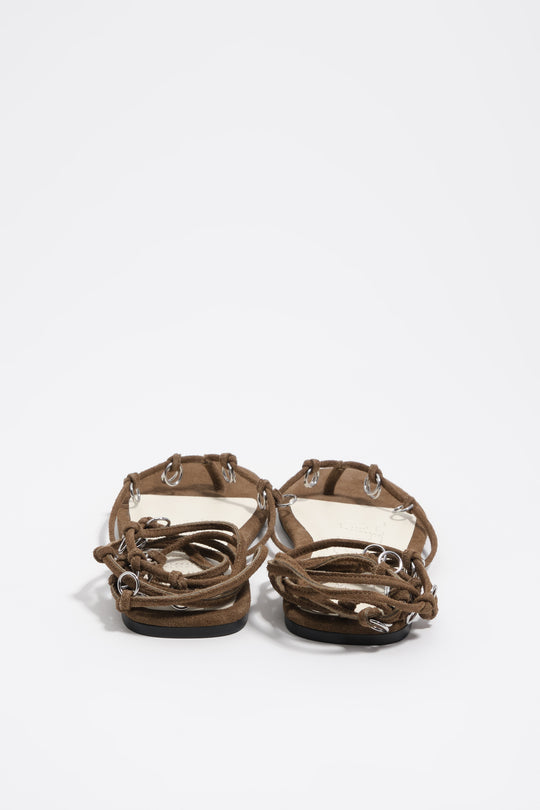 Olive suede sandal with piercings