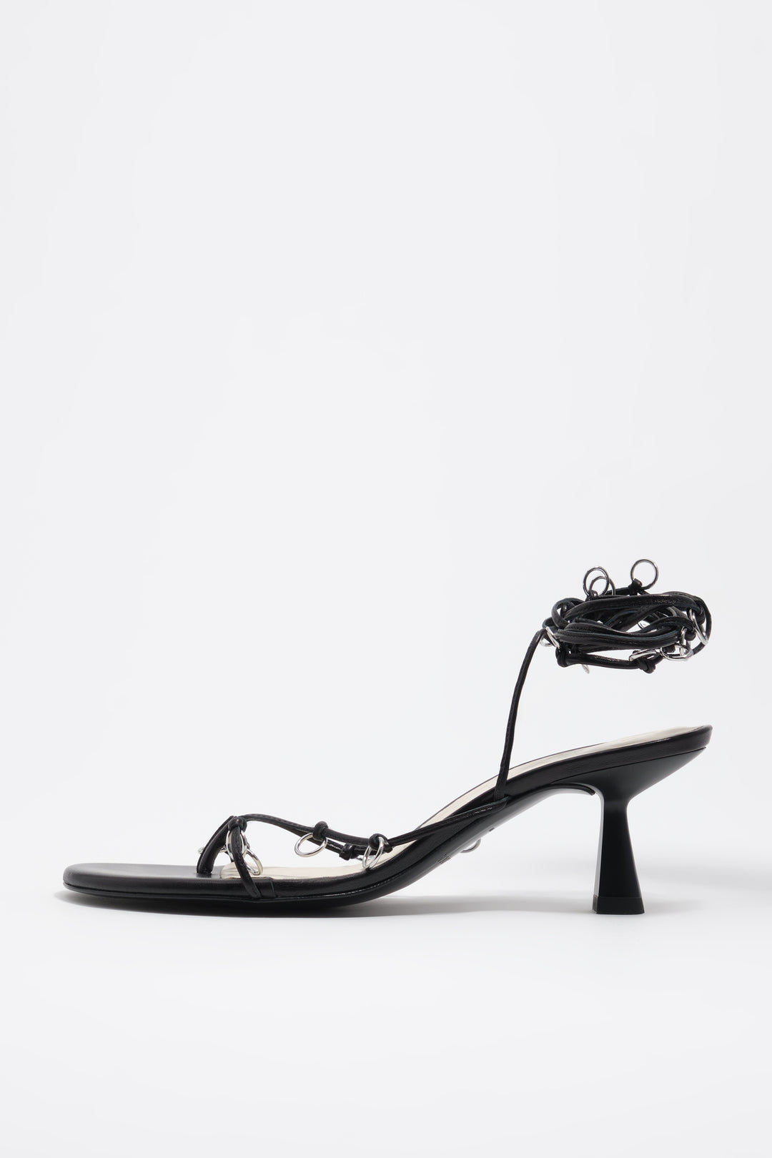 Black leather heeled sandal with piercings
