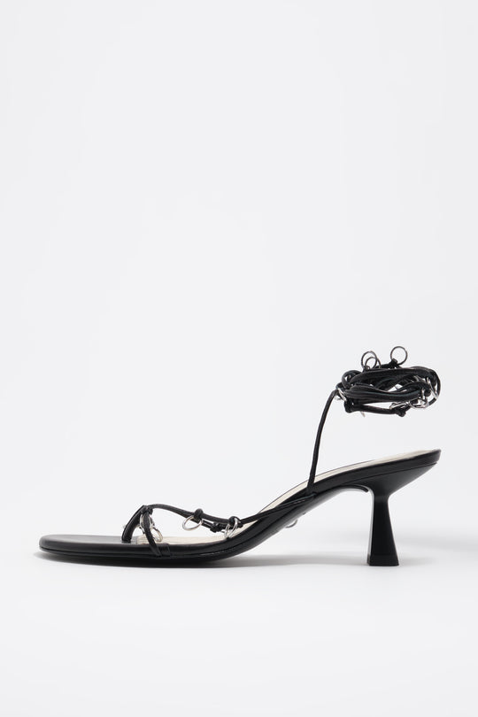 Black leather heeled sandal with piercings