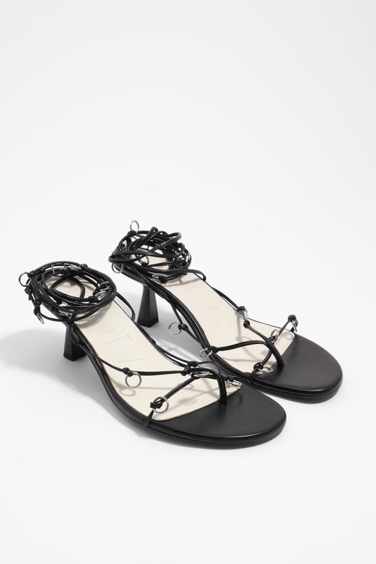 Black leather heeled sandal with piercings